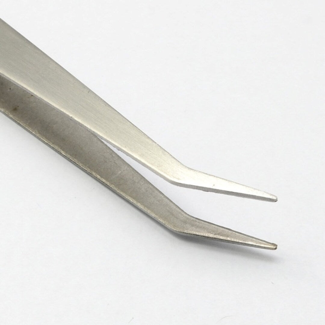 Pinza para aplicacion de cristales