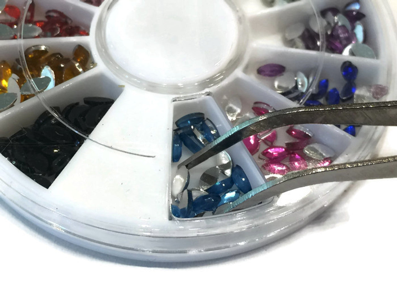 Pinza para aplicacion de cristales