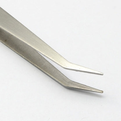 Pinza para aplicacion de cristales